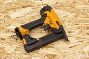 A yellow nail gun